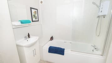 Bathtub, hair dryer, towels