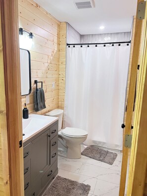 Combined shower/tub, hair dryer, towels, soap