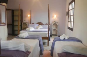 Quarto quádruplo standard | Frigobar, roupa de cama