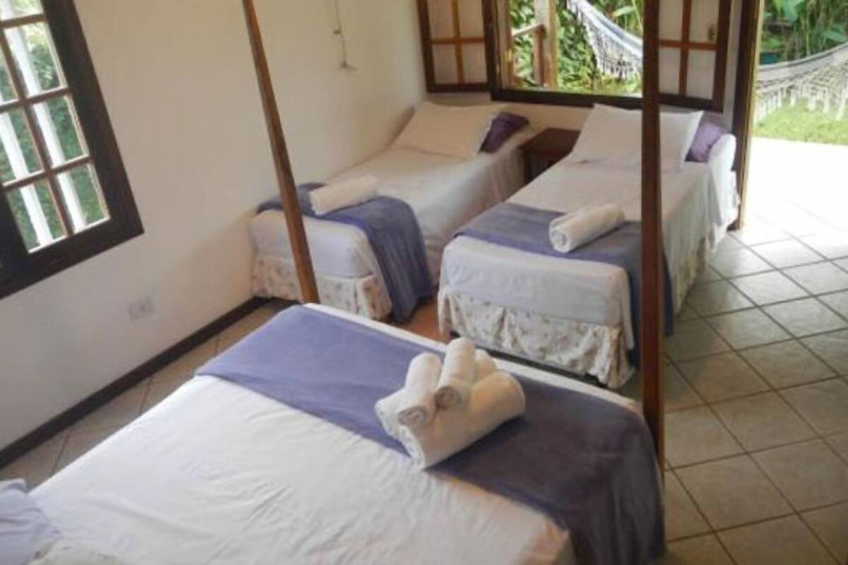 Quarto quádruplo standard | Frigobar, roupa de cama