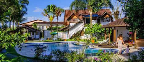 Outdoor pool, pool umbrellas, sun loungers