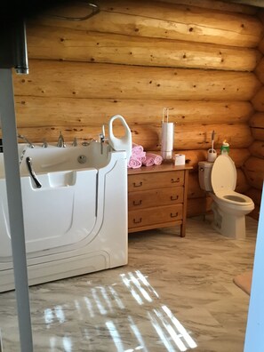 Bathtub, jetted bath, hair dryer, towels