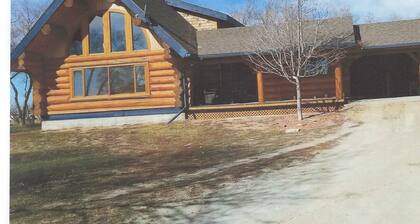 Three level Log Home on Private 40 Acre Estate.
