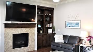 Smart TV, fireplace, books, offices