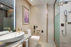 A modern bathroom with two sinks, a glass shower enclosure, and a telephone. - Lavande Hotel (Guilin Longsheng) (Longsheng)
