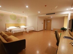 A hotel room with two beds, a sofa, a desk with a computer, and a TV. - Greentree Inn Anyang Neihuang County Zaoxiang Avenue (Anyang)
