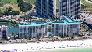 A large hotel complex with multiple high-rise buildings, a beachfront, and a golf course in the background. - ☀️By Beach in Seascape-Wow!22nd FL Gulf Views-3 Pools-2BR Ariel Dunes II 2203☀️ (Destin)