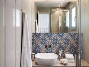 Shower, towels, soap, shampoo