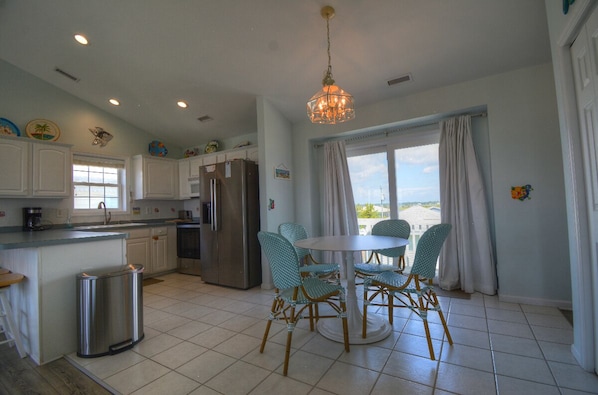Fridge, microwave, oven, stovetop - Experience comfort in this 4-bedroom house in beautiful Topsail Beach, NC. (Topsail Beach)