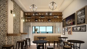 Zona de bar con diversas opciones de asientos, una bodega con botellas y vistas panorámicas de la ciudad a través de amplios ventanales.