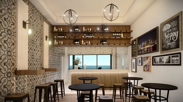 Zona de bar con diversas opciones de asientos, una bodega con botellas y vistas panorámicas de la ciudad a través de amplios ventanales.