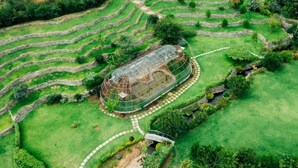 A terraced garden with a greenhouse structure. - Storms Resort (Nanyuki)