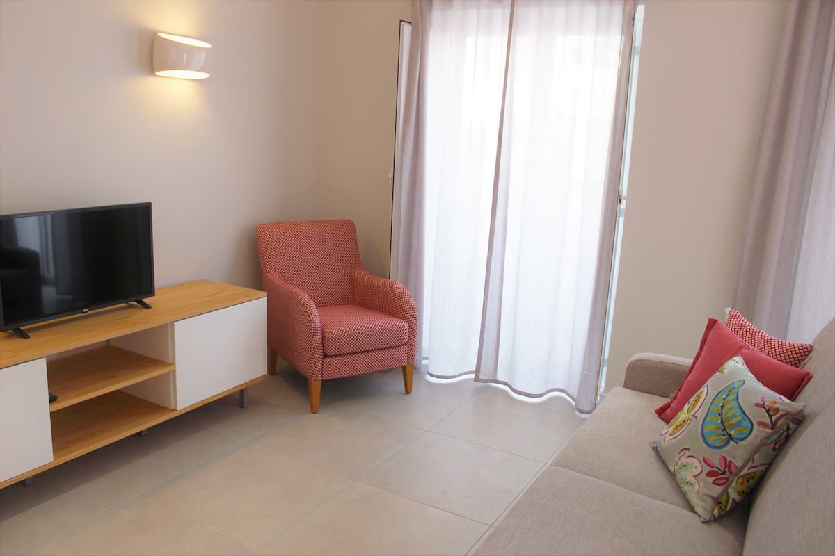 Premium Condo | Living room | 75-cm LCD TV with cable channels, TV