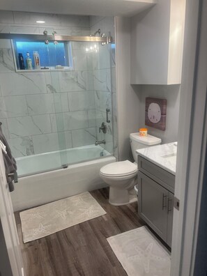 Bathtub, hair dryer, towels, soap