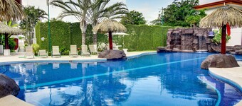 Amazing waterfront oasis with furnished terrace, multiple pools, & beach access