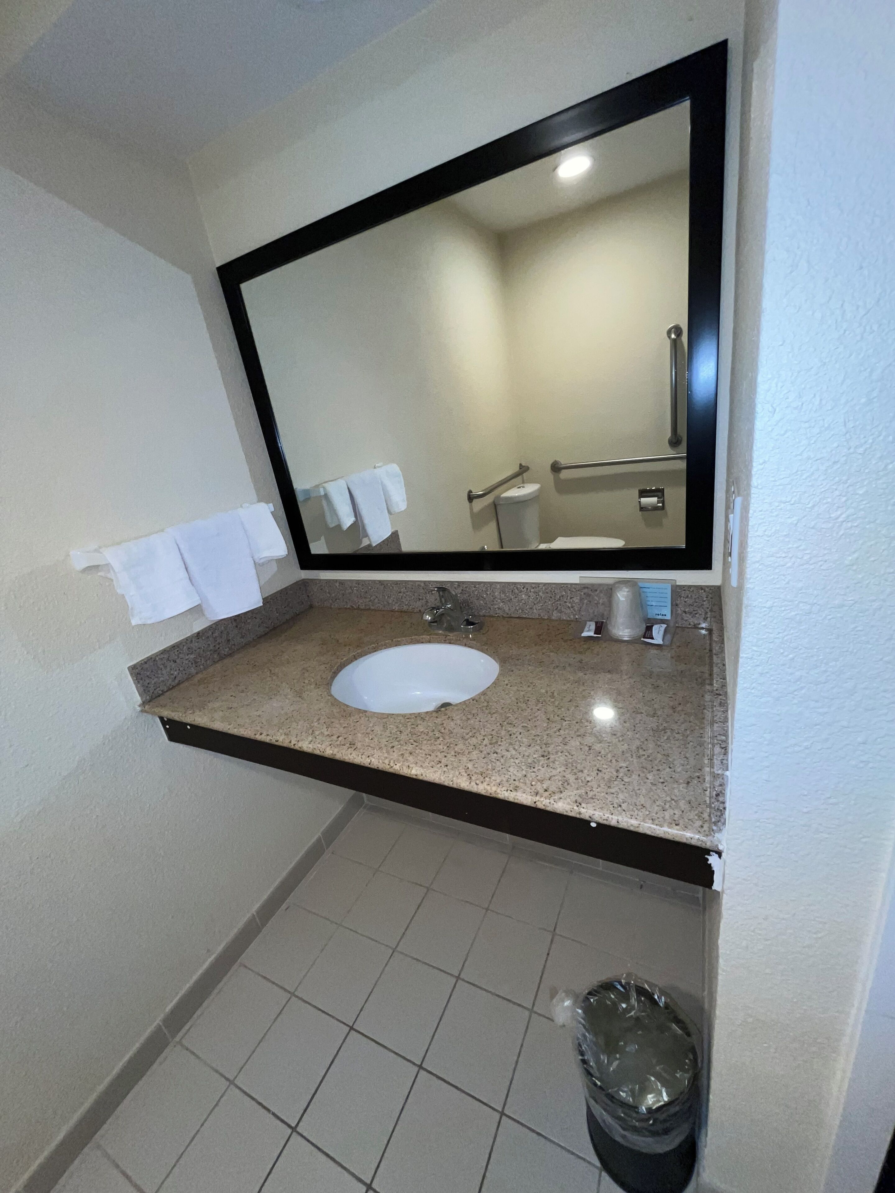 Senior Single Room, 1 King Bed | Bathroom | Combined shower/bathtub, free toiletries, towels, soap