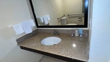Senior Single Room, 1 King Bed | Bathroom | Combined shower/bathtub, free toiletries, towels, soap