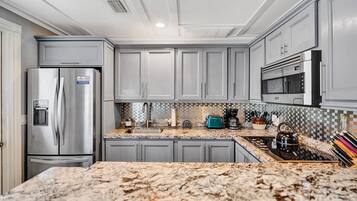 Fridge, microwave, stovetop, coffee/tea maker