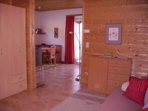 Apartment, 1 Bedroom, Terrace | Living room | Flat-screen TV