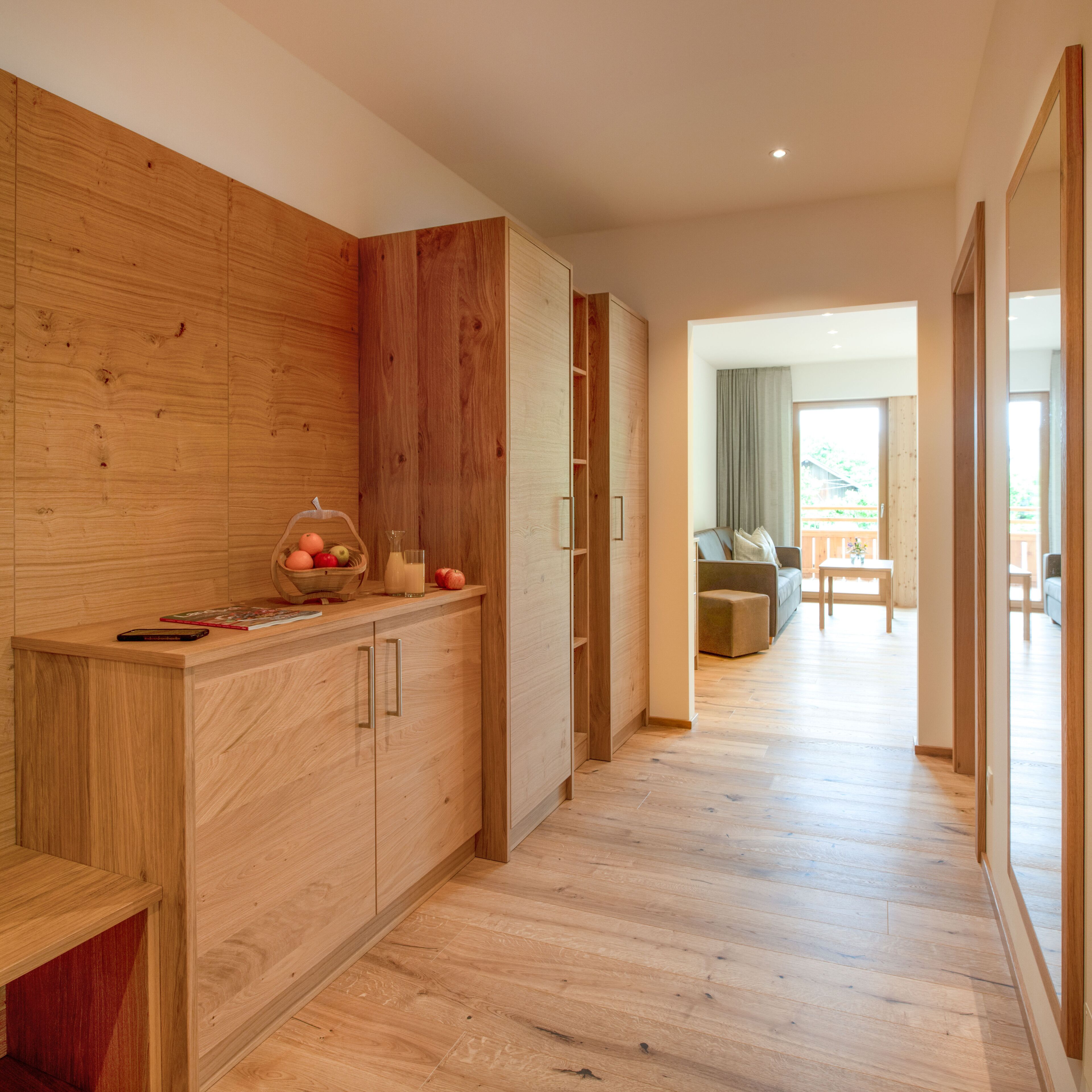 A modern kitchen with wooden cabinetry and a countertop.