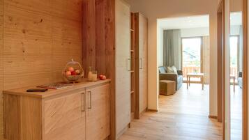 A modern kitchen with wooden cabinetry and a countertop.