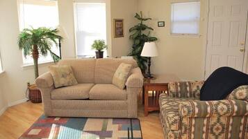 House, Multiple Beds (1860 Beach Dr. #2) | Living room | Fireplace