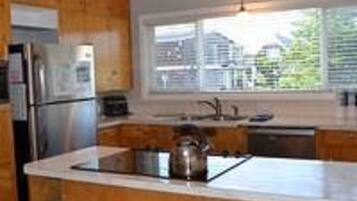 House, Multiple Beds (1881 Beach Dr) | Private kitchen | Spices, paper towels