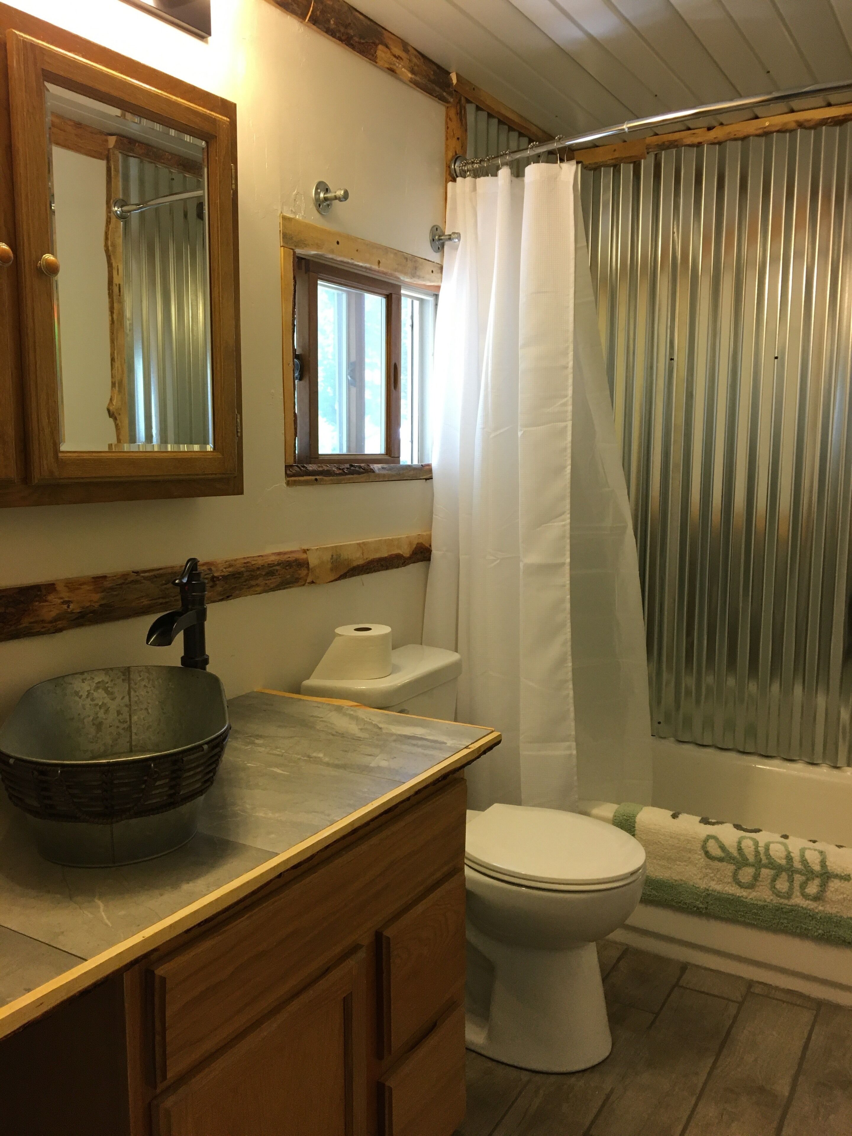 Combined shower/tub, hair dryer, towels, soap