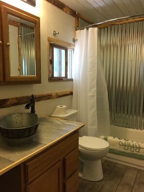Combined shower/tub, hair dryer, towels, soap