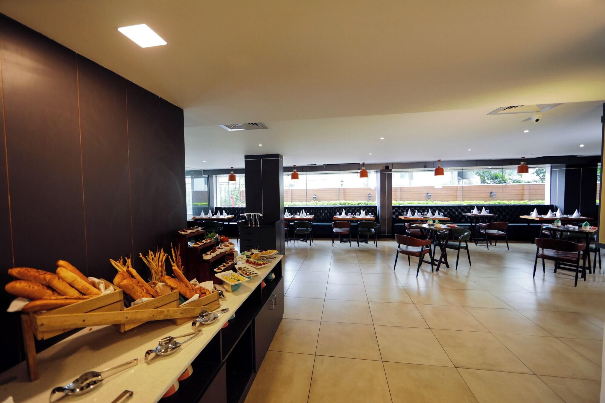 A buffet setup with various food items and seating arrangements.