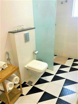 A bathroom with a toilet, a shower, and a sink. - The Zinc By The Fern (Bengaluru)