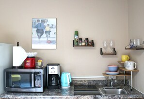 Fridge, microwave, stovetop, coffee/tea maker
