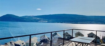 Unobstructed panoramic water & mountain lake front cottage