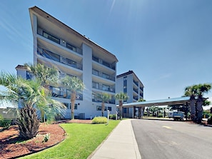 Stunning hotel building with modern design, flat roof, and spacious balconies.