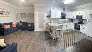 A modern apartment with a living area, kitchen, and dining space. - Beautiful Oceanview House in Ocean Lakes (Myrtle Beach)
