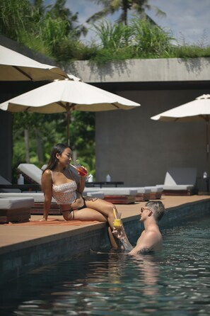 Outdoor pool, open 6:00 AM to 10:00 PM, pool umbrellas, sun loungers