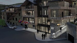 A multi-story building with balconies, large windows, and a prominent 'W' logo. - The Sky Residences at W Aspen (Aspen)