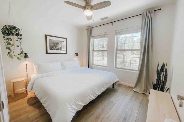 King sized tuft & needle mattress (supportive & super comfortable), room darkening curtains & blinds, 100% cotton sheets & a sound machine for a peaceful nights sleep