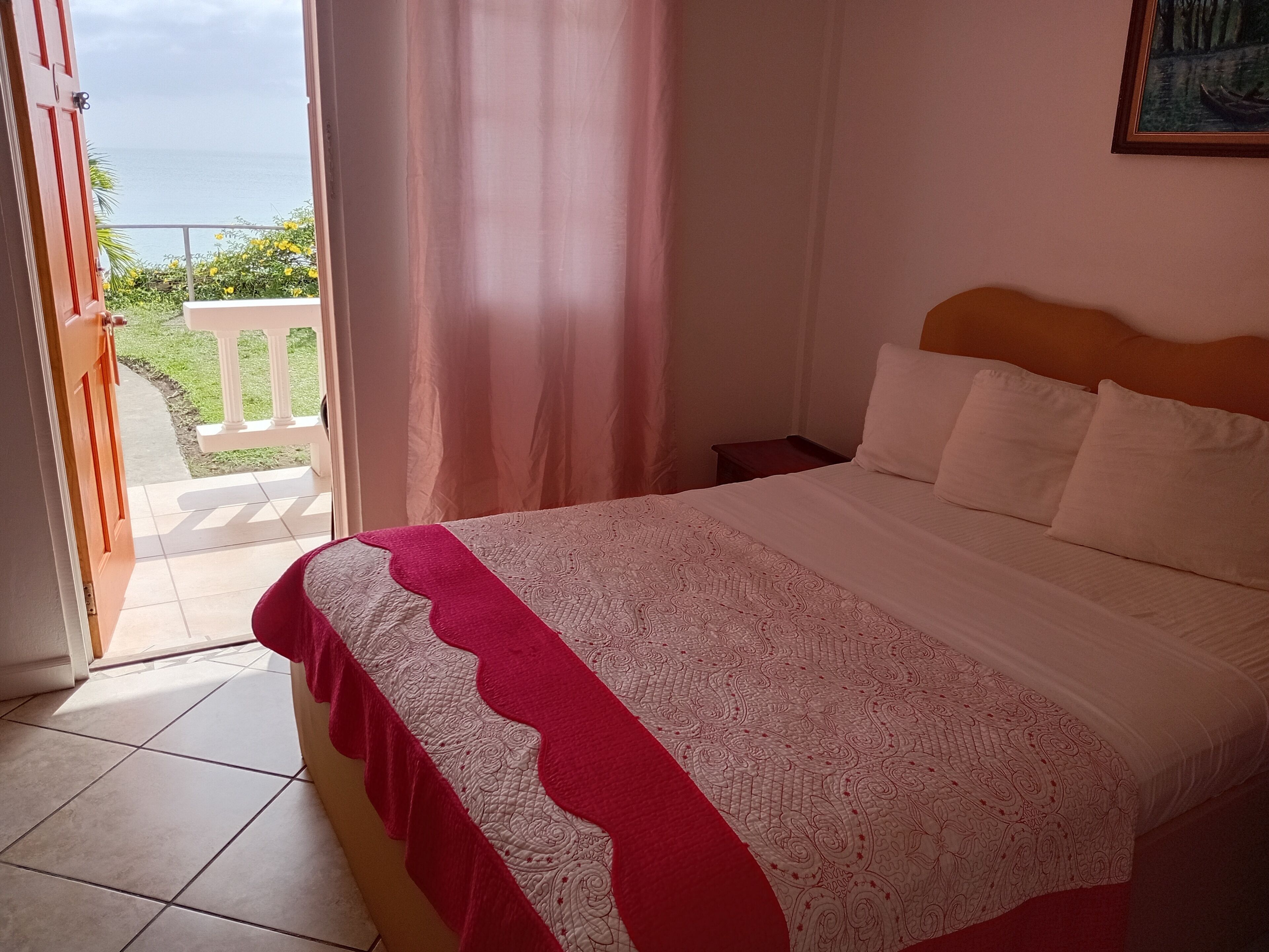 Standard Room, Ocean View | In-room safe, iron/ironing board, free WiFi, bed sheets