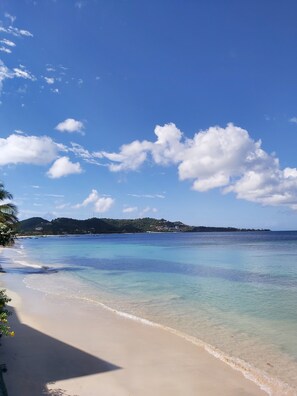 On the beach, white sand, sun loungers, beach towels - Grand Anse Beach Palace (St. George's)