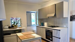 Coffee/tea maker, fridge, oven, stovetop - The Apartment · Casa del Fattore, Villa Luzi (Marche)