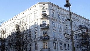A multi-story building with a classic architectural style, featuring balconies and a street sign indicating 'Bredowstraße' and 'Wichstrasse'. - MyHappyplace in the middle of Berlin (Berlin)