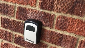A brick wall with a security device labeled "Master Lock." - Inviting 2-bed Apartment in Hemsby (Great Yarmouth)