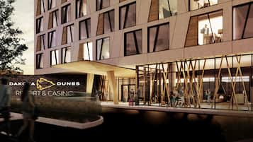 Un edificio moderno con un cartel que dice "Dak'a Dunes Resort & Casino".