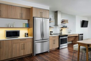 Microwave, coffee/tea maker, cookware/dishes/utensils, dining tables