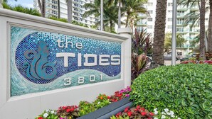 A hotel sign with a mosaic design and the name "The Tides 3801". - The Tides Ocean Luxury Suites (Hollywood)