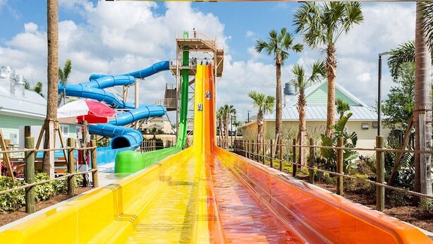 A water park with multiple slides in blue, green, yellow, and orange. - Contemporary Disney Vacation Home - 5 min to Disney (Kissimmee)
