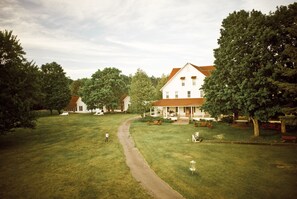 Stroll through the traditional grounds, surrounded by mature trees, to the main building.