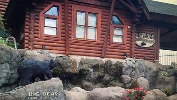 A rustic log cabin with a sign reading "Big Bear Lodge and Resort." - Dollywood pigeon forge Cabin, Pools, Game Room, Hot tub, 0.5 mile to Parkway (Pigeon Forge)