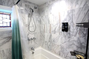 Combined shower/tub, hair dryer, towels, soap